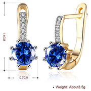 Blue Topaz 0.70 CT Round Huggie Earring in 18K White Gold Plated