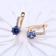 Blue Topaz 0.70 CT Round Huggie Earring in 18K White Gold Plated