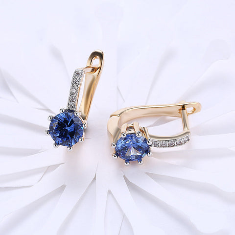 Blue Topaz 0.70 CT Round Huggie Earring in 18K White Gold Plated