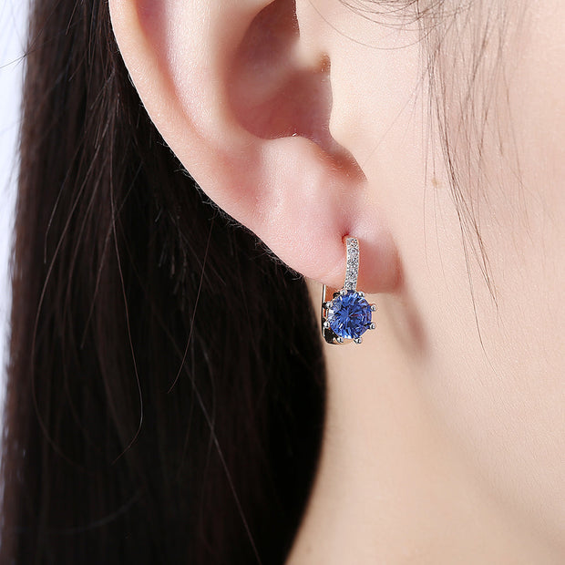 Blue Topaz 0.70 CT Round Huggie Earring in 18K White Gold Plated